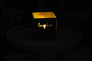 stainless steel candle holder with the word Inspire cut out.  Beautiful!